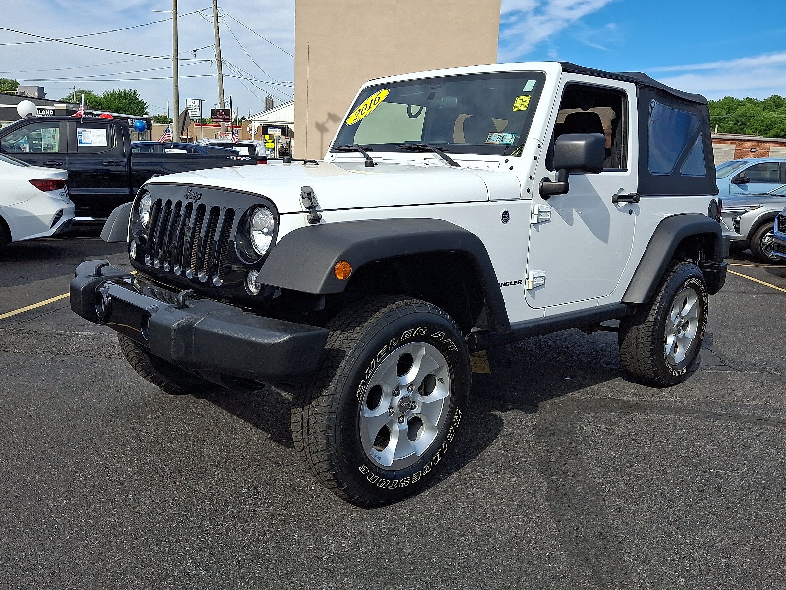 2016 Jeep Wrangler Willys Wheeler 4WD in Bright White Clearcoat — front three-quarter view