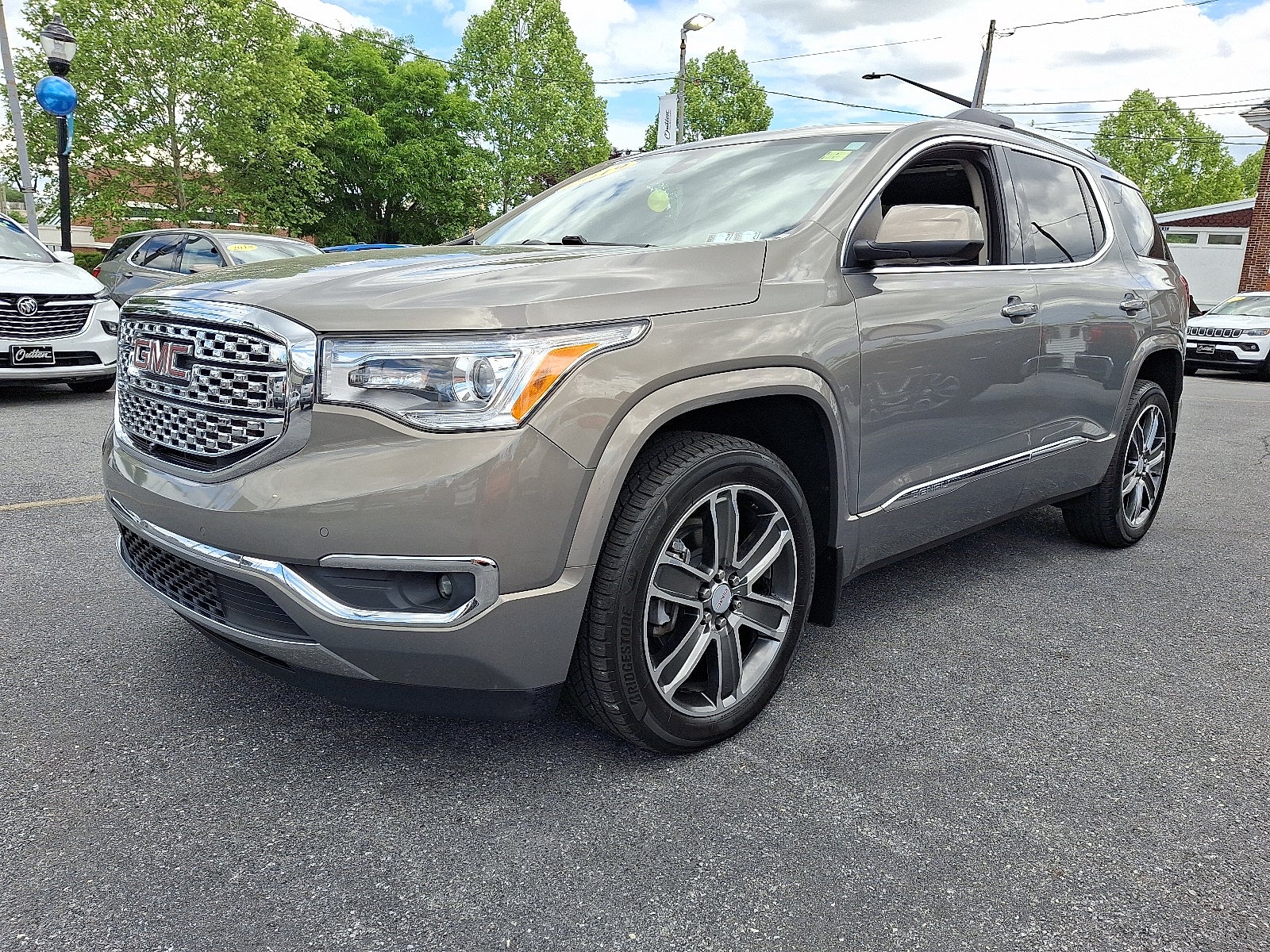 2019 GMC Acadia Denali AWD in Pepperdust Metallic — front three-quarter view