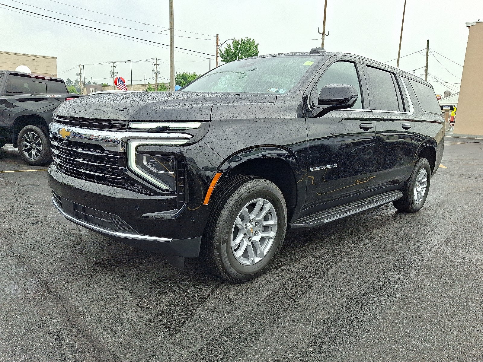 2026 Chevrolet Suburban LS 4WD in Black — front three-quarter view