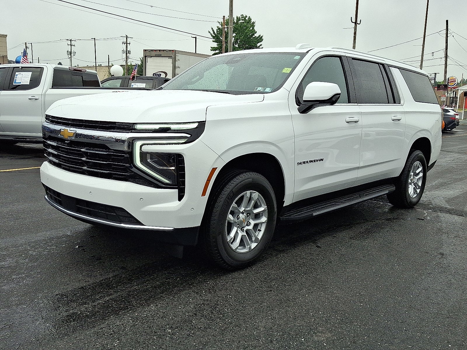 2026 Chevrolet Suburban LS 4WD in Summit White — front three-quarter view