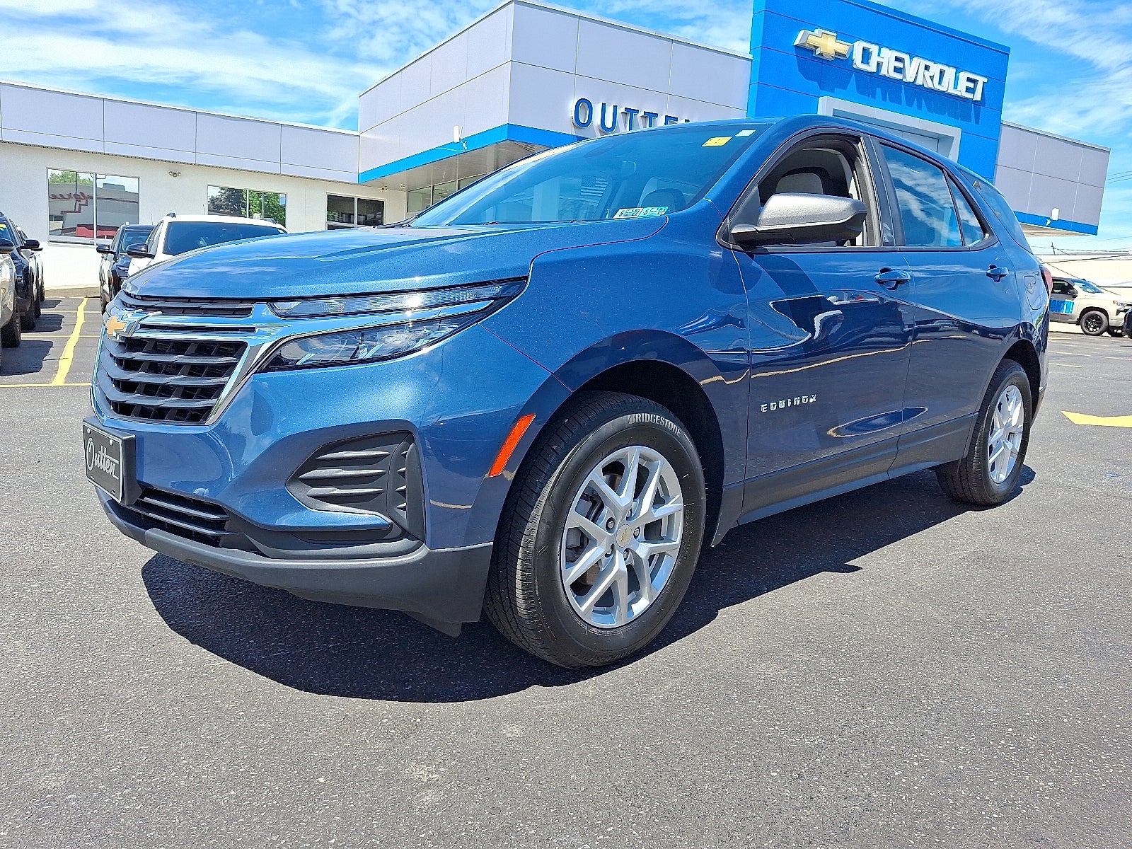 2024 Chevrolet Equinox LS AWD in Lakeshore Blue Metallic — front three-quarter view