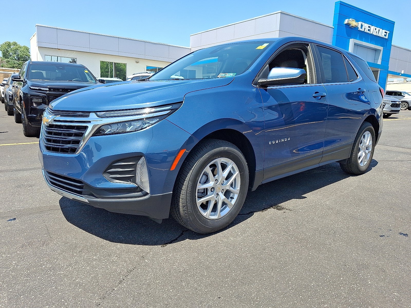 2024 Chevrolet Equinox LT AWD in Lakeshore Blue Metallic — front three-quarter view