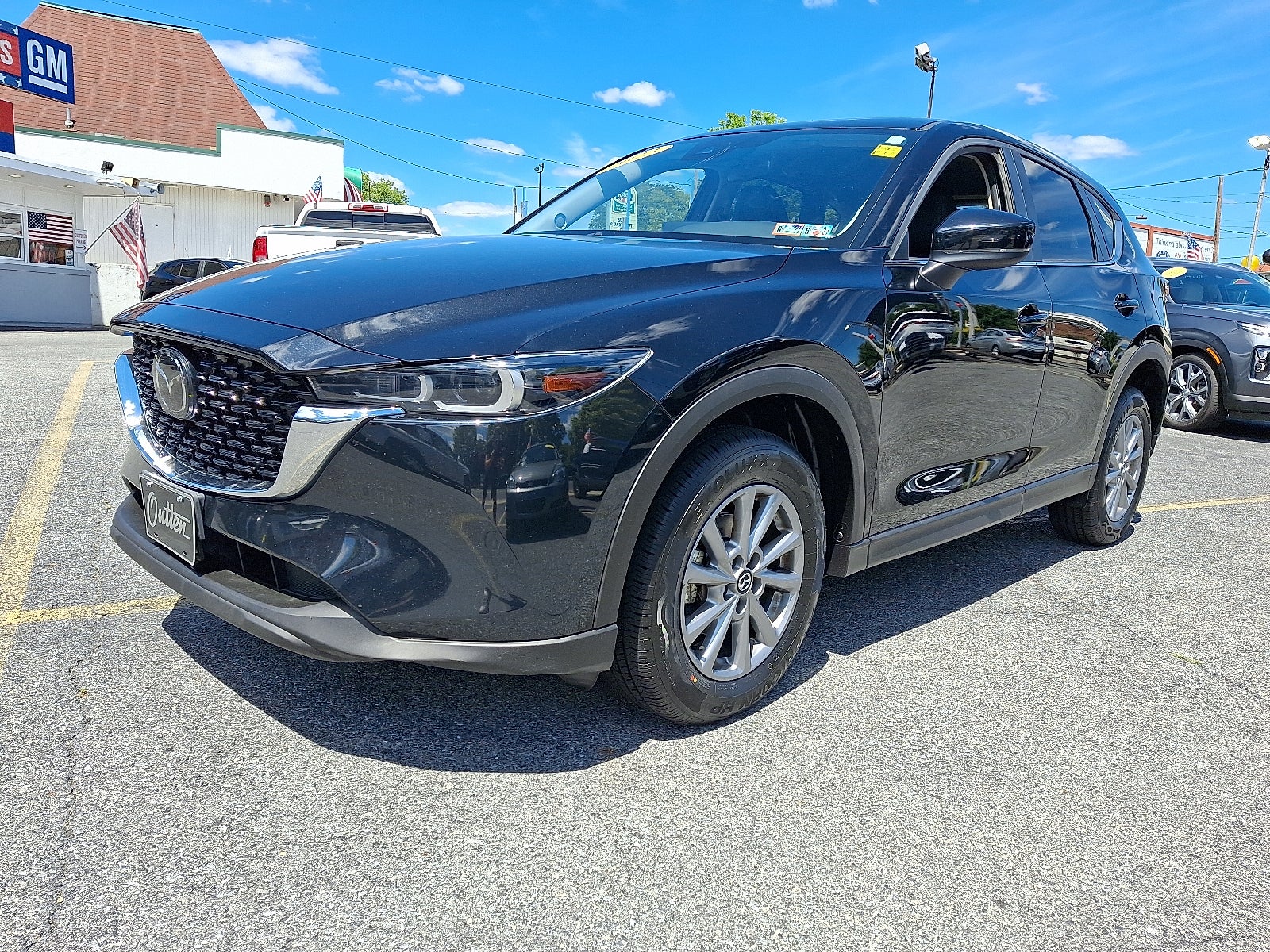 2023 Mazda Mazda CX-5 2.5 S Select AWD in Jet Black Mica — front three-quarter view
