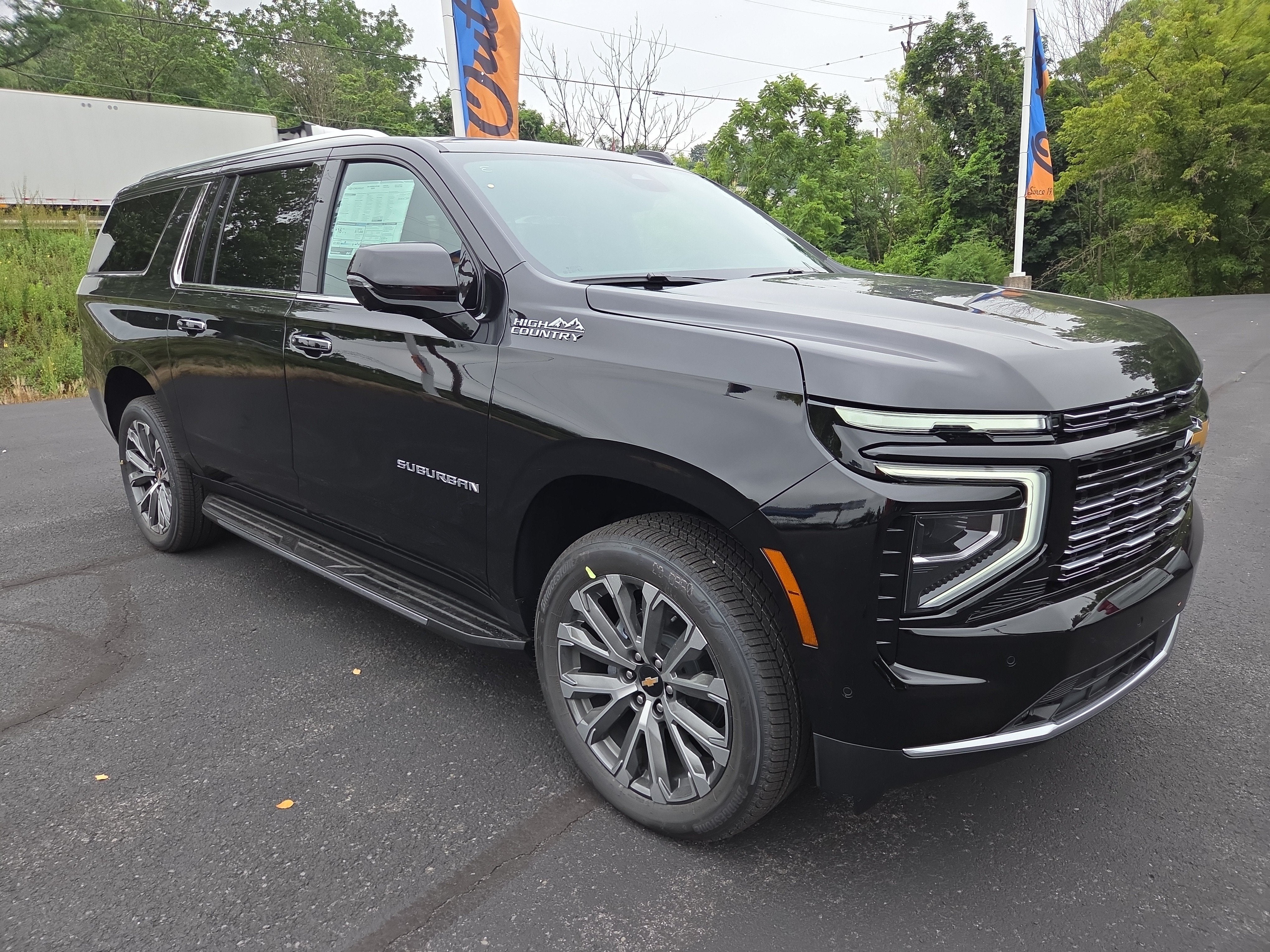 2026 Chevrolet Suburban High Country 4WD in Black — front three-quarter view