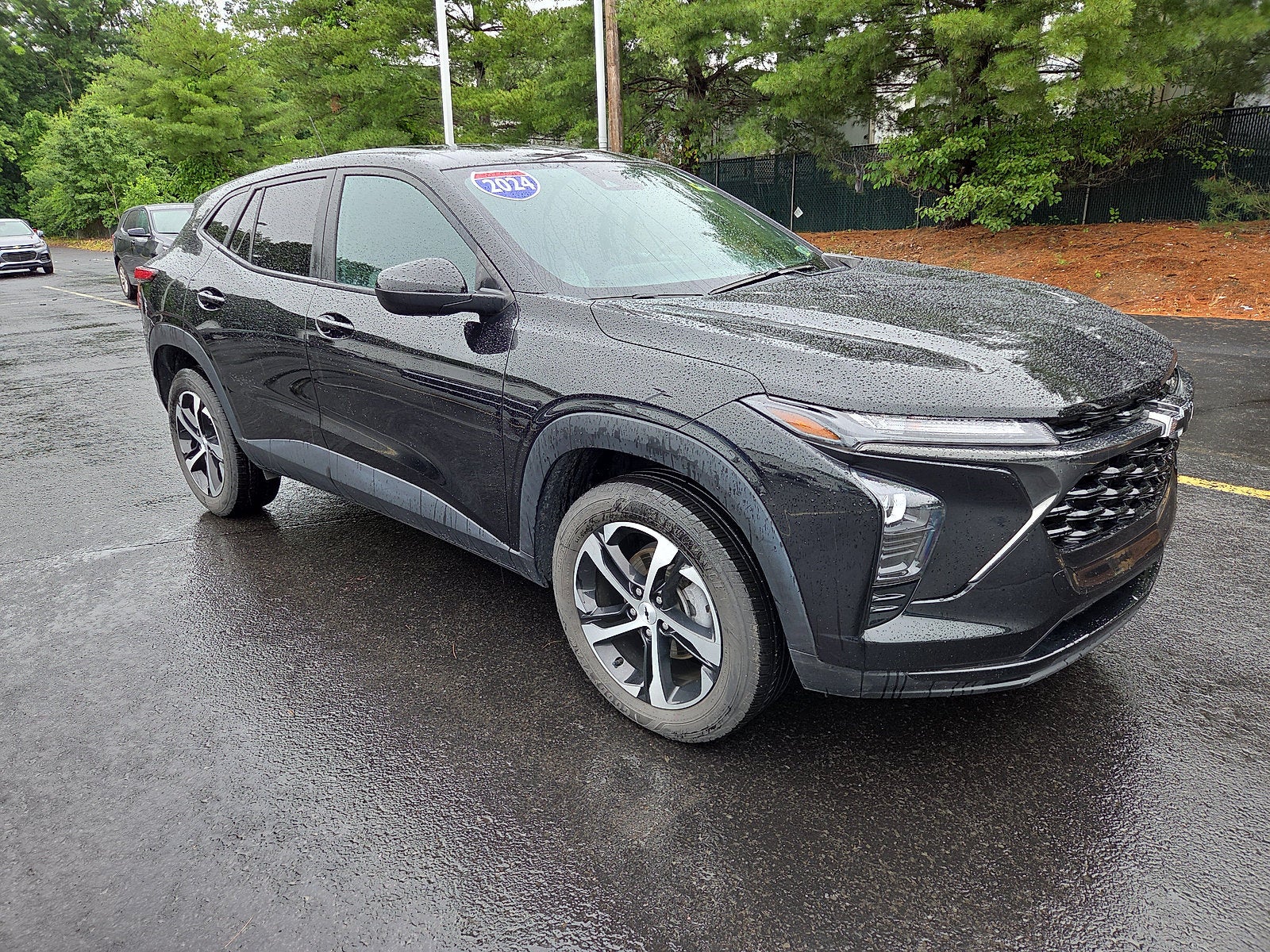 2024 Chevrolet Trax 1RS FWD in Mosaic Black Metallic — front three-quarter view