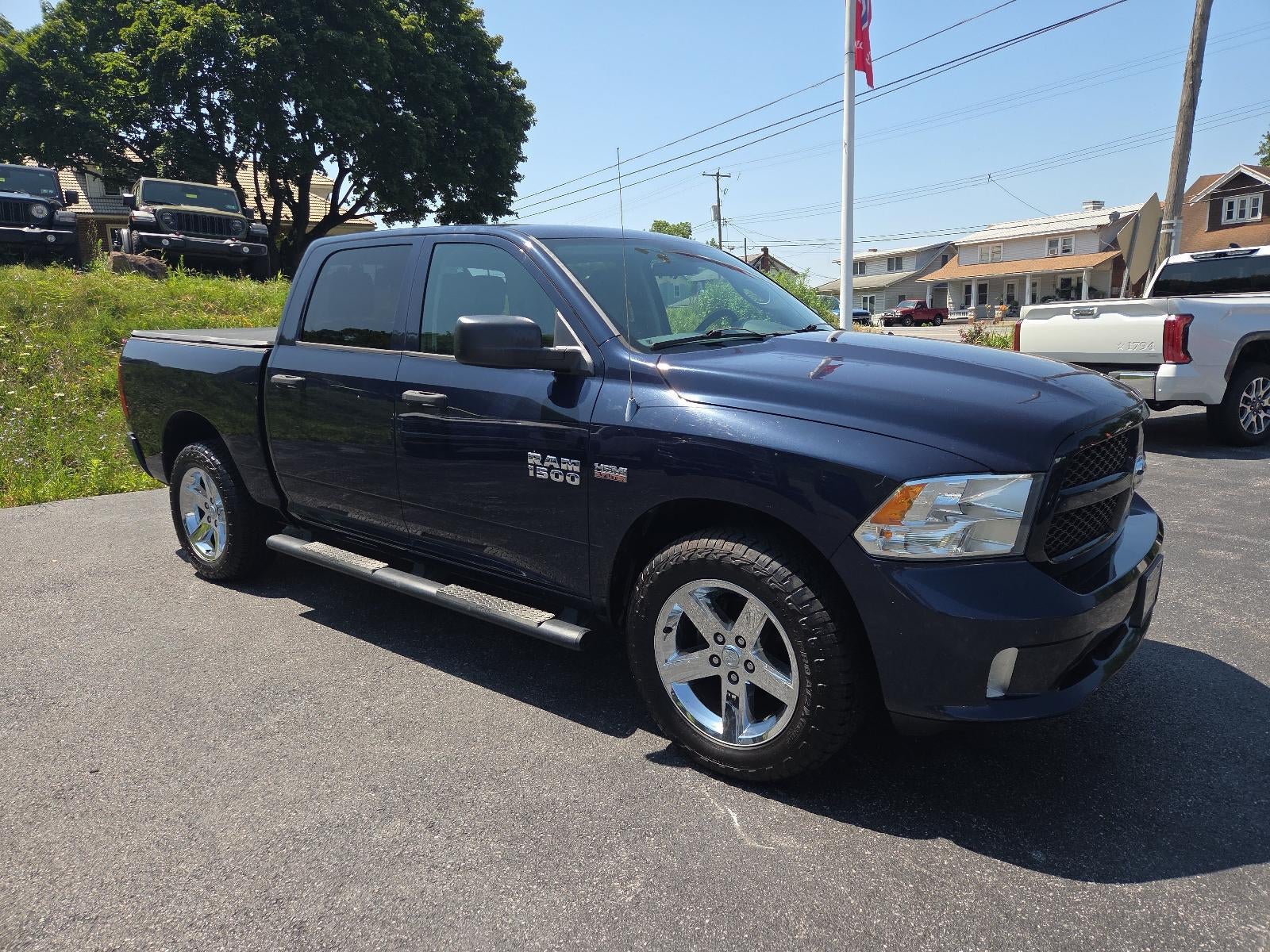 2014 RAM 1500 4WD Crew Cab 5.7 Ft Box Express in True Blue Pearlcoat — front three-quarter view