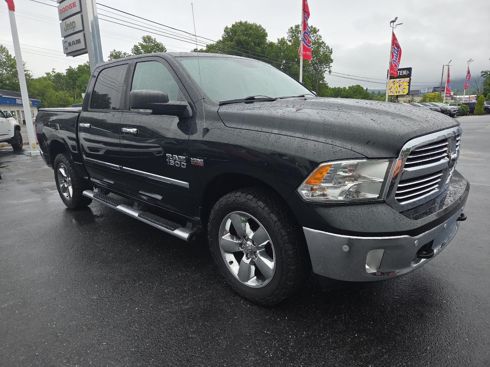 2016 RAM 1500 4WD Crew Cab 5.7 Ft Box Big Horn in Black Forest Green Pearlcoat — front three-quarter view