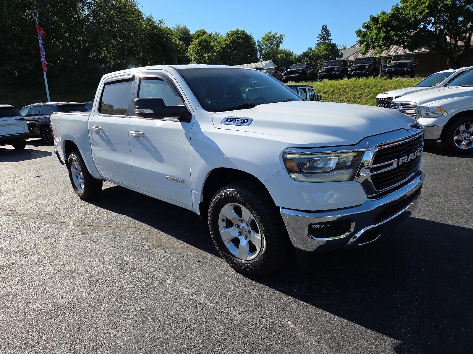 2021 RAM 1500 Big Horn 4x4 Crew Cab 5'7" Box in Bright White Clearcoat — front three-quarter view