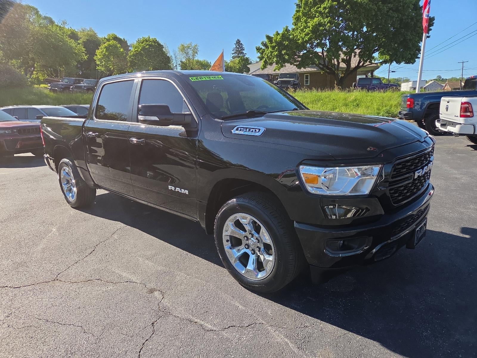 2022 RAM 1500 Big Horn 4x4 Crew Cab 5'7" Box in Diamond Black Crystal Pearlcoat — front three-quarter view
