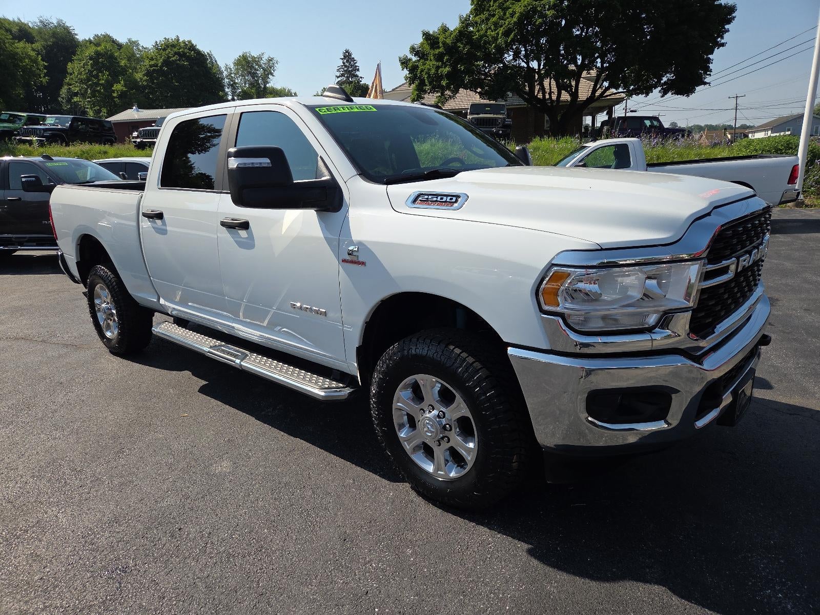 2024 RAM 2500 Big Horn 4x4 Crew Cab 6'4" Box in Bright White Clearcoat — front three-quarter view