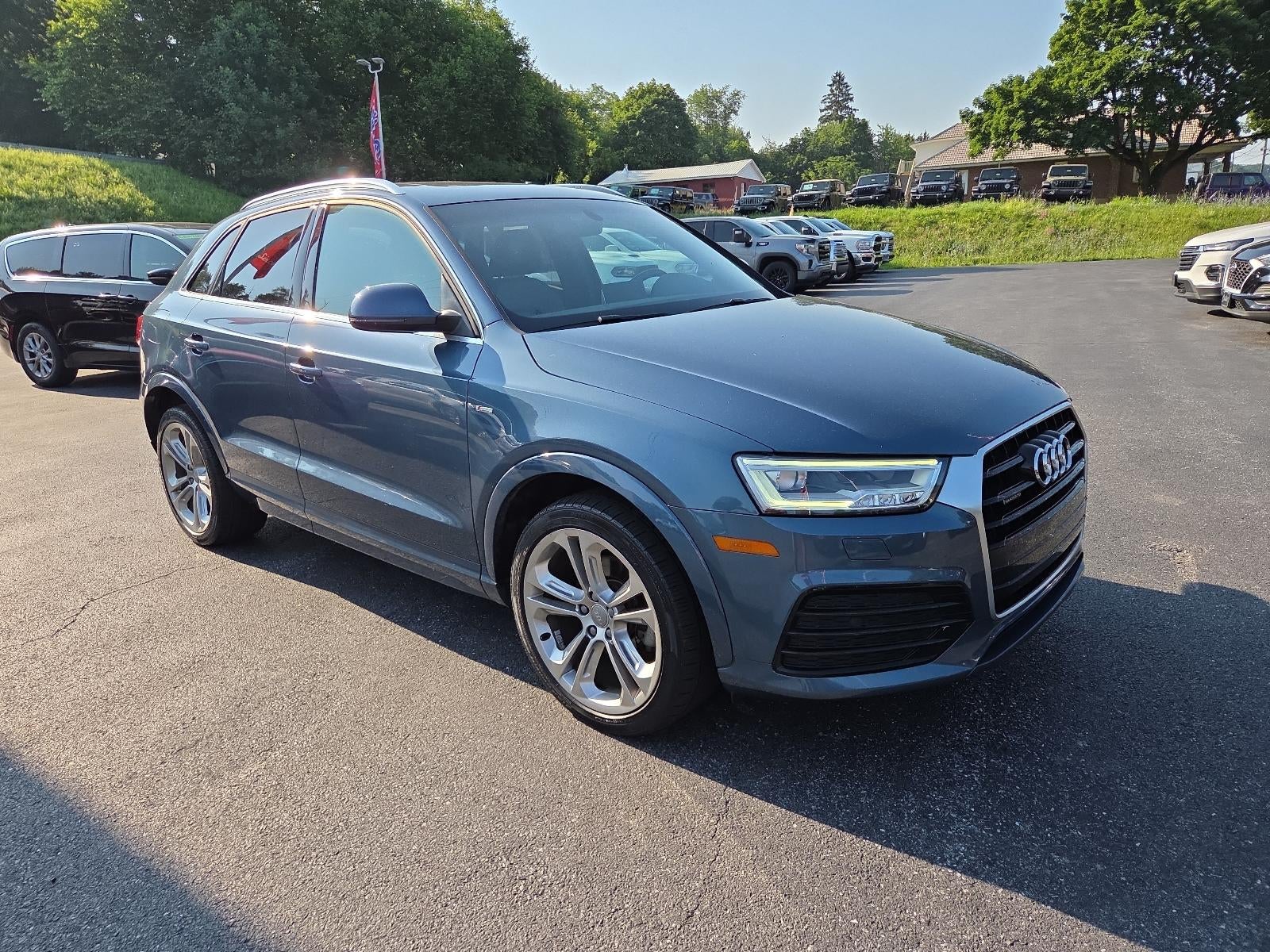 2018 Audi Q3 2.0 TFSI Premium Plus quattro AWD in Utopia Blue Metallic — front three-quarter view