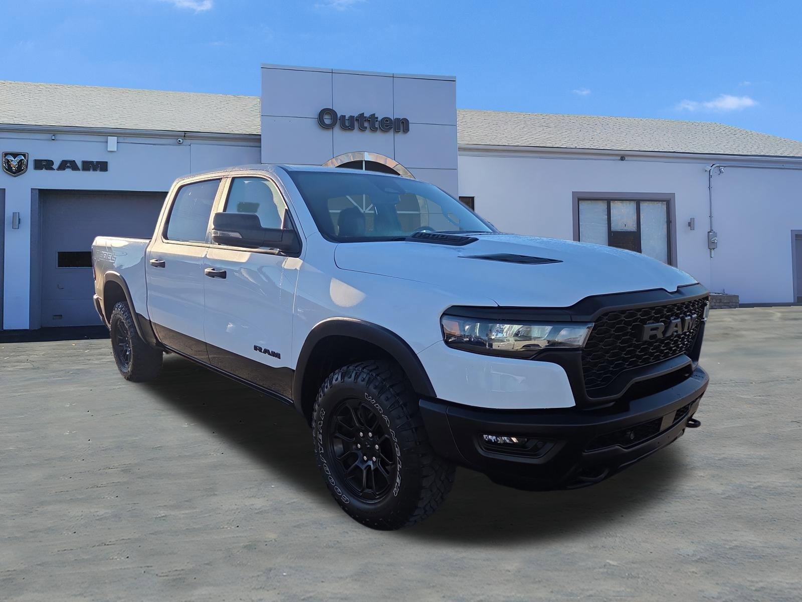 2025 RAM 1500 Rebel 4x4 Crew Cab 5'7" Box in Bright White Clearcoat — front three-quarter view