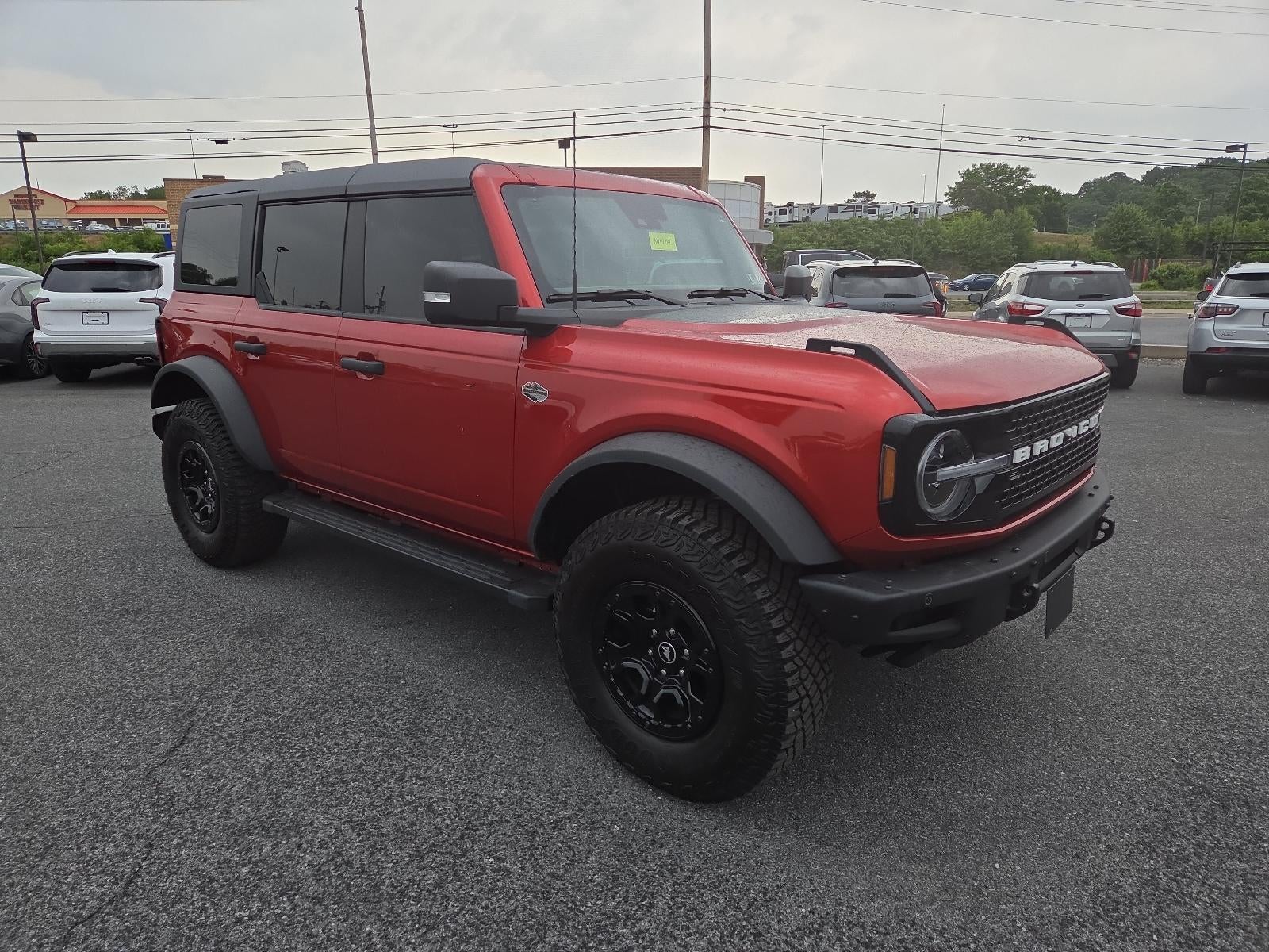 2024 Ford Bronco Wildtrak 4 Door Advanced 4x4 in Hot Pepper Red Metallic Tinted Clearcoat — front three-quarter view