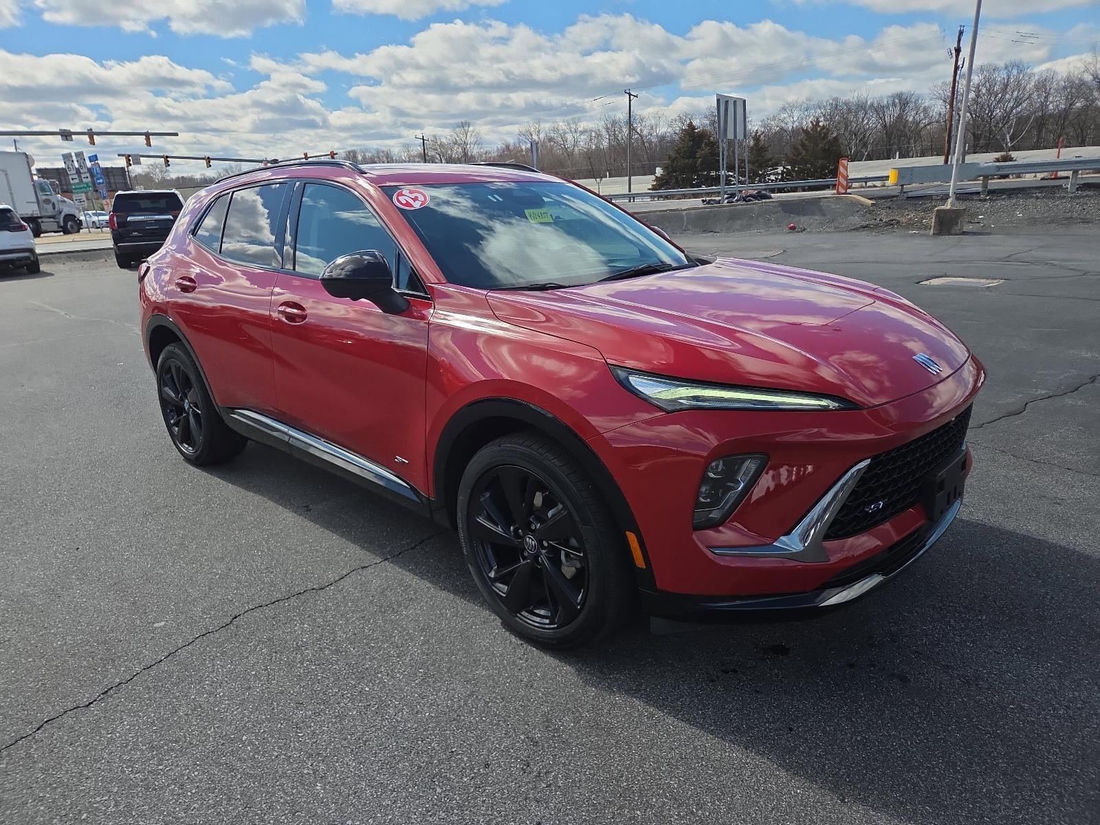 2025 Buick Envision AWD 4dr Sport Touring in Brilliant Red — front three-quarter view